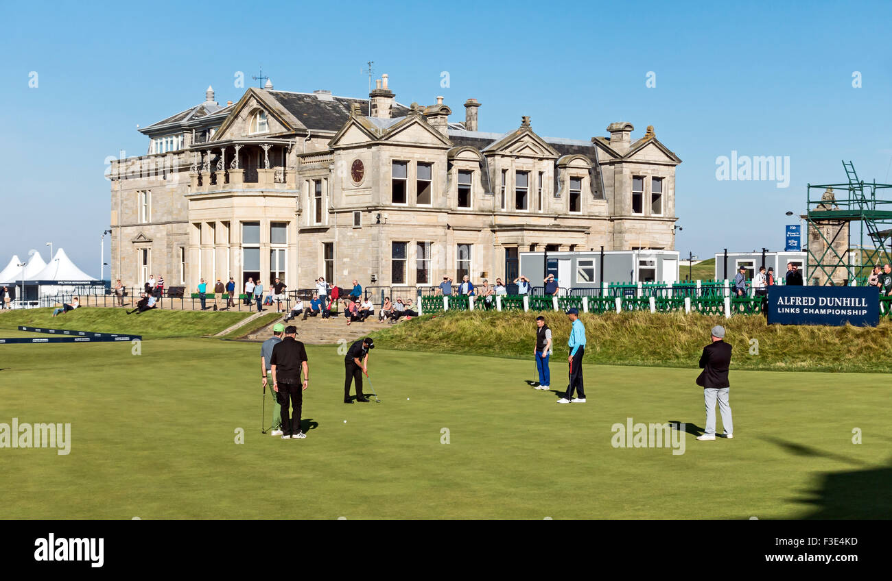 The Old Course and clubhouse at St. Andrews Scotland with golfers putting on 18th hole before Alfred Dunhill Links Championship Stock Photo