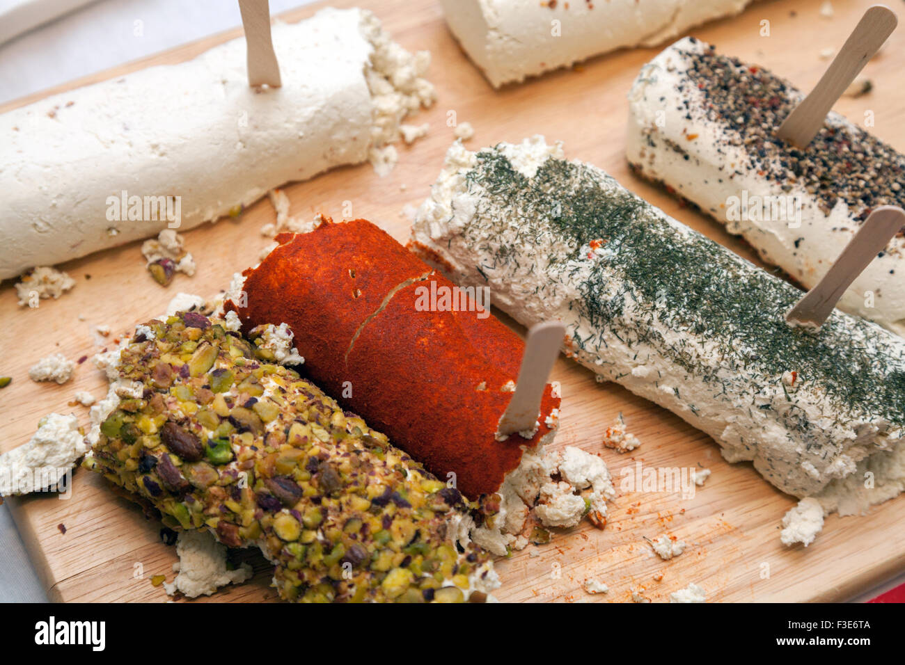 Cheese with spices on wooden surface Stock Photo