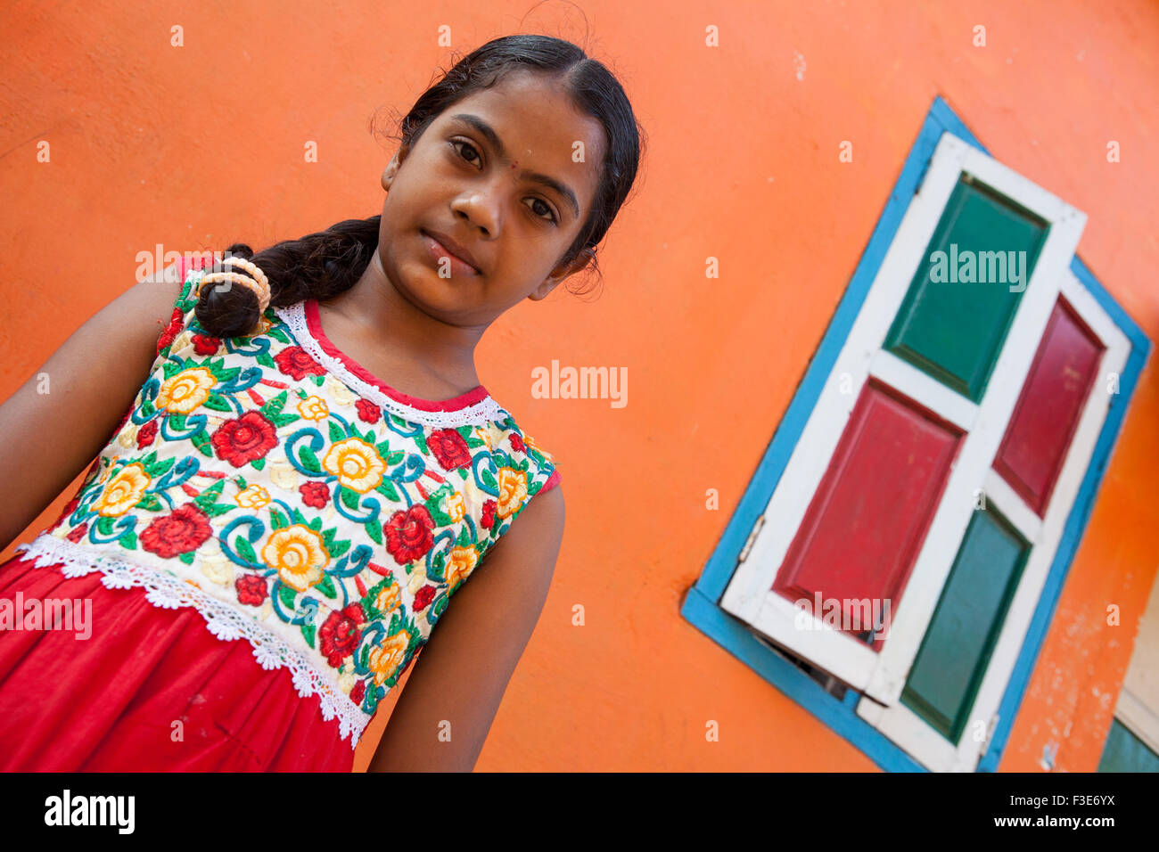 Portrait of a girl standing outside her house in Mahabalipuram Stock Photo