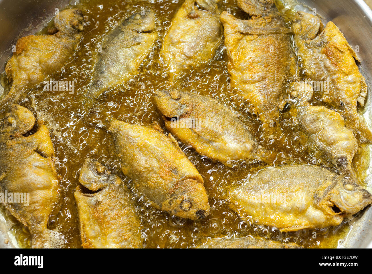 Small fishes of the Greek sea roasted in the frying pan Stock Photo