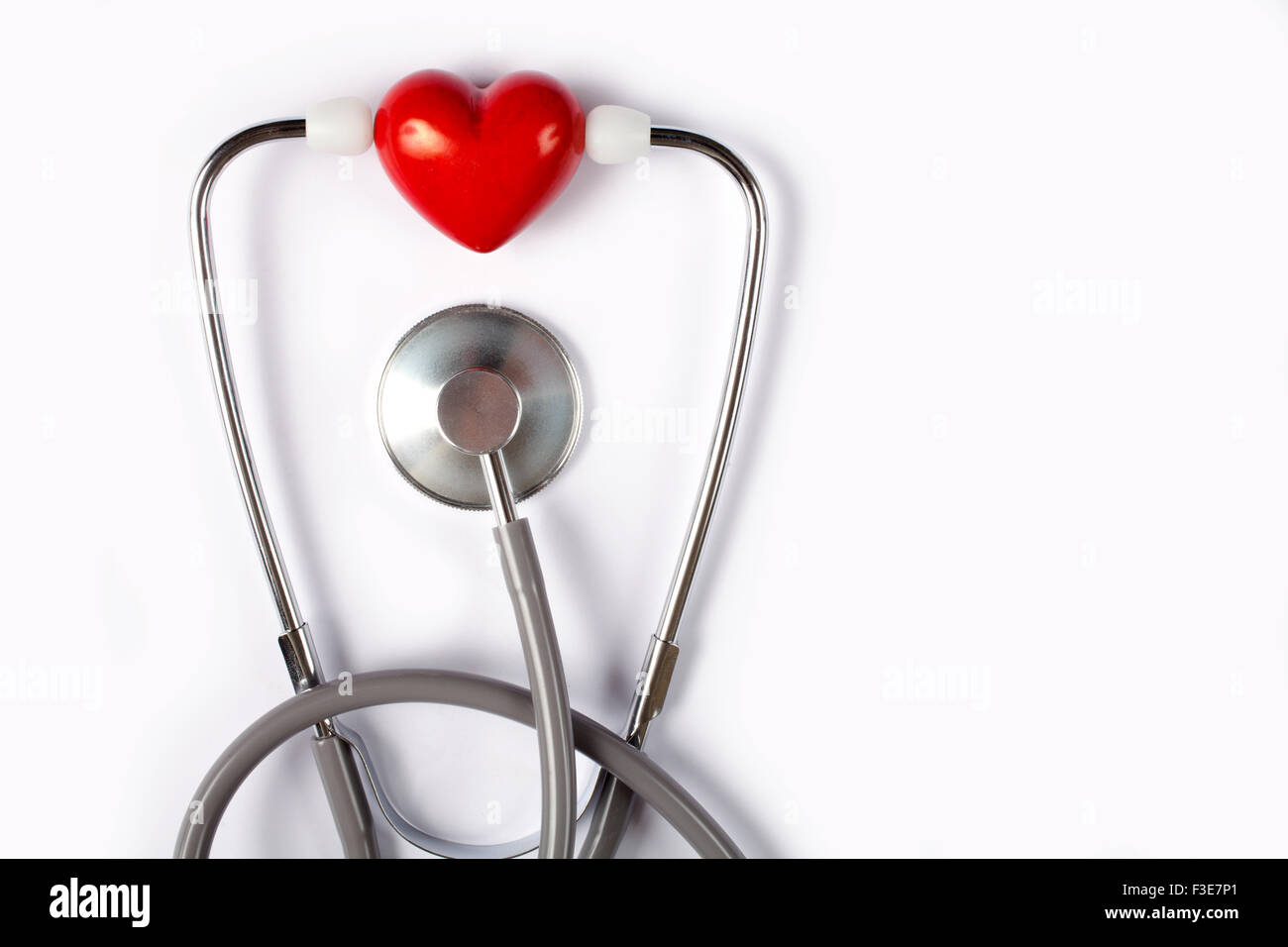 Stethoscope & red heart on white background Stock Photo - Alamy