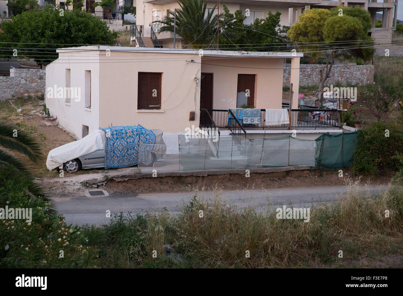 Stucco home with carport in Lefkakia, Greece Stock Photo