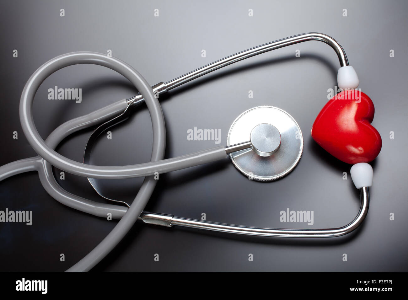 Stethoscope & red heart on X-ray background Stock Photo - Alamy