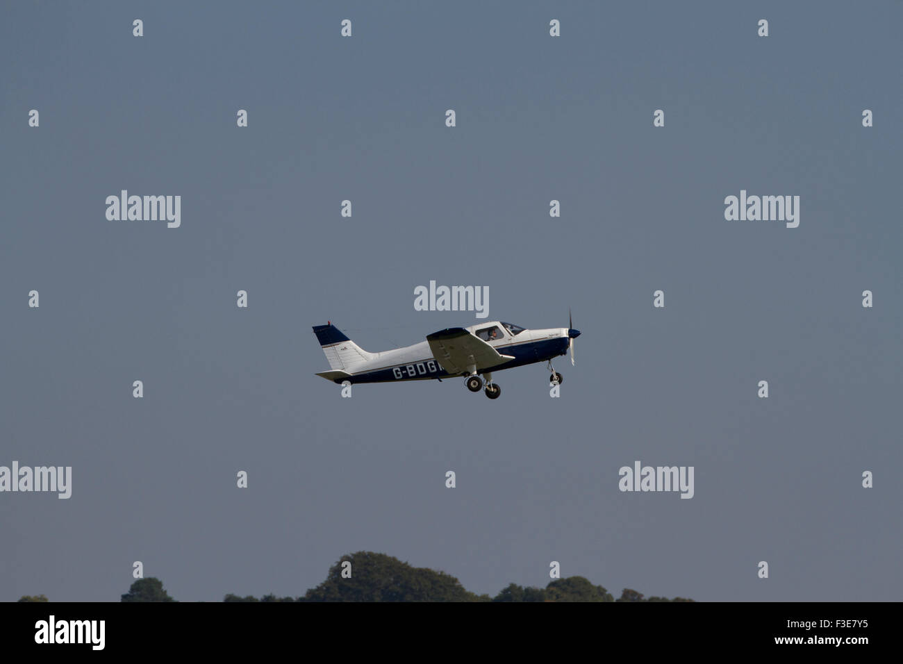 Single engined light aircraft climbing shortly after takeoff from Wolverhampton Airport. UK Stock Photo