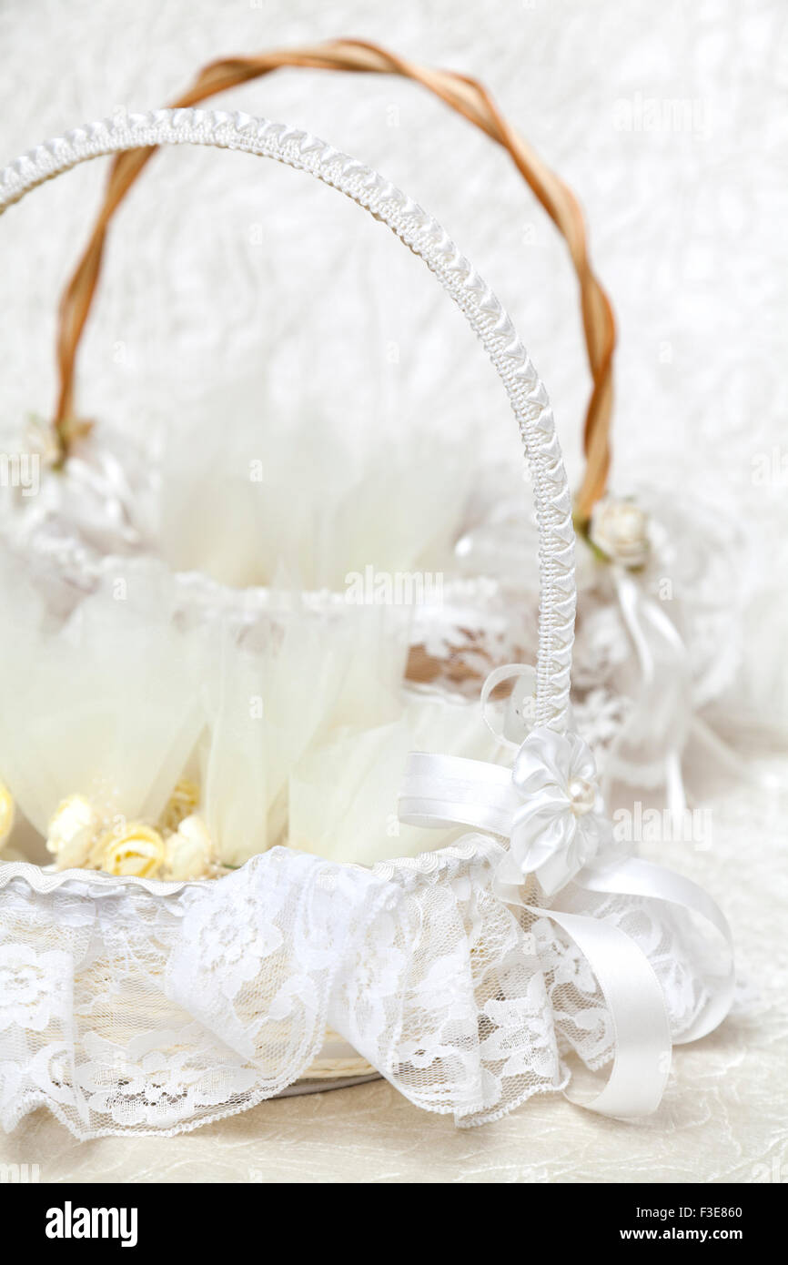 Elegant Wedding Favors decorated with artificial flowers in basket