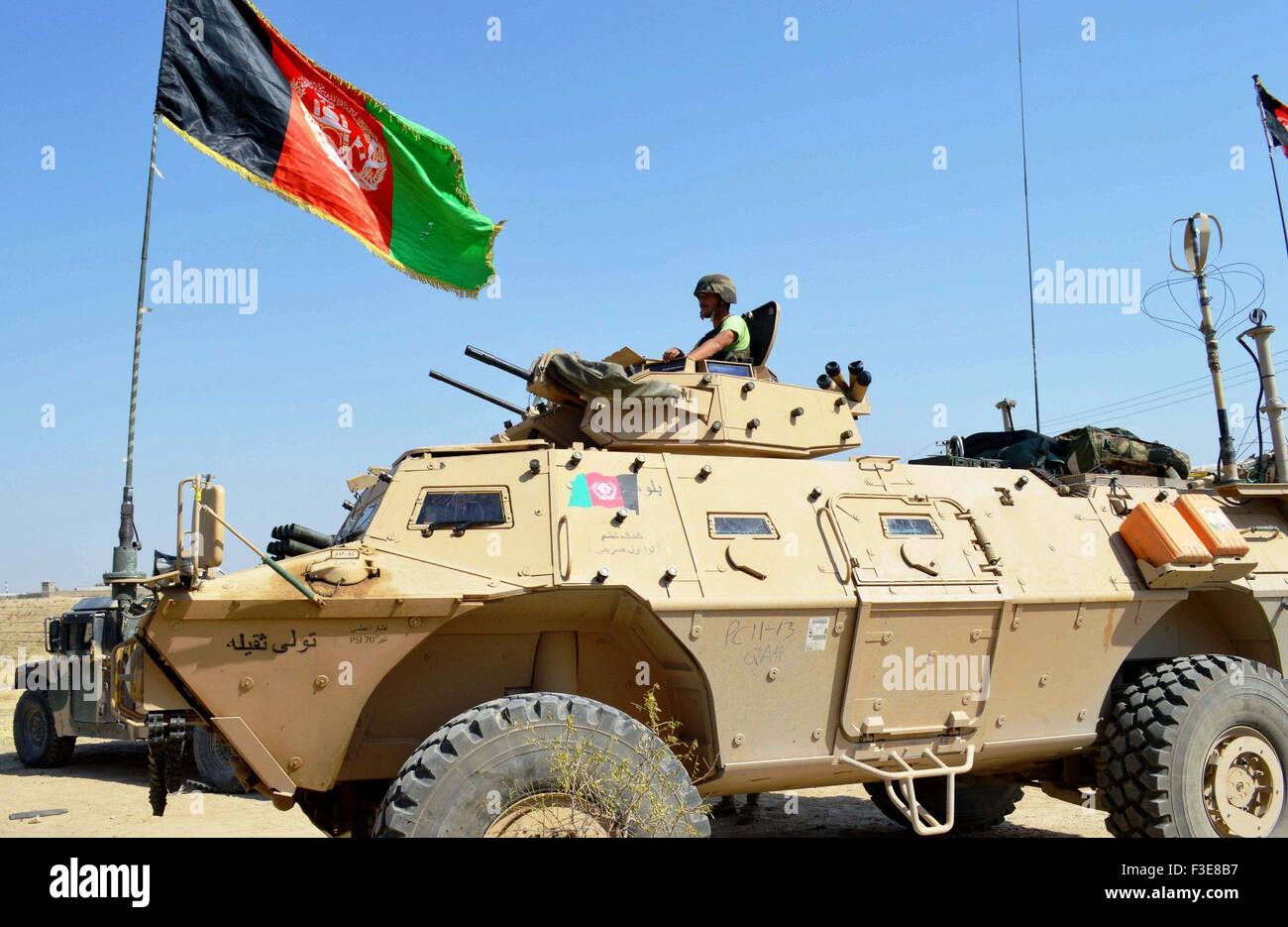 Kunduz. 6th Oct, 2015. An Afghan soldier sits on the top of a military vehicle in Kunduz province of Afghanistan, Oct. 6, 2015. Afghan security forces after five days of fierce fighting were able to reopen the road linking Baghlan to Kunduz city and sent reinforcement there to bolster government positions against Taliban fighters, police said. Credit:  Ajmal/Xinhua/Alamy Live News Stock Photo