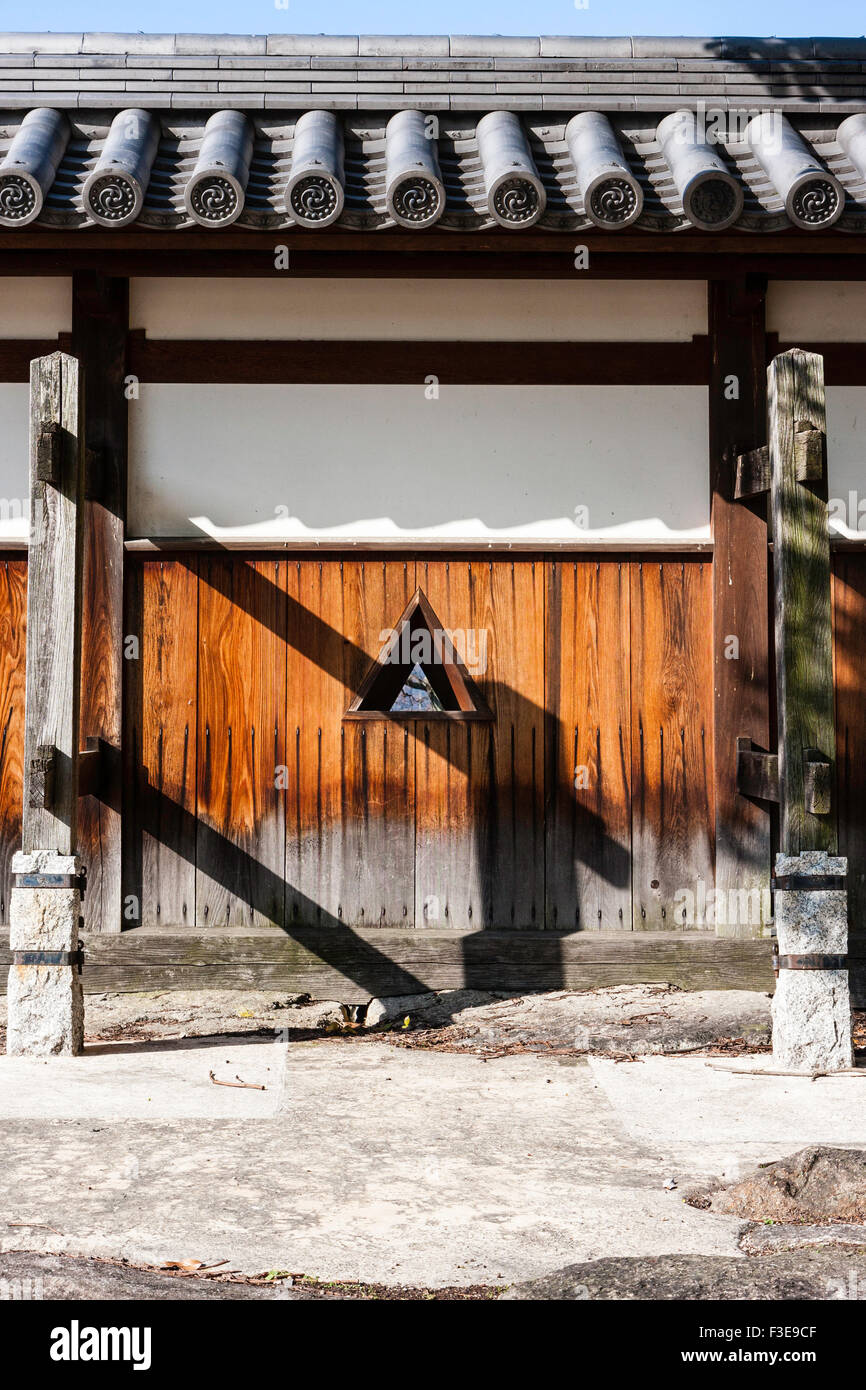 Hiroshima castle. Typical dobei wall as seen at many castles in Japan. Wood and plaster roofed wall with inner supports and shooting holes, sama. Stock Photo