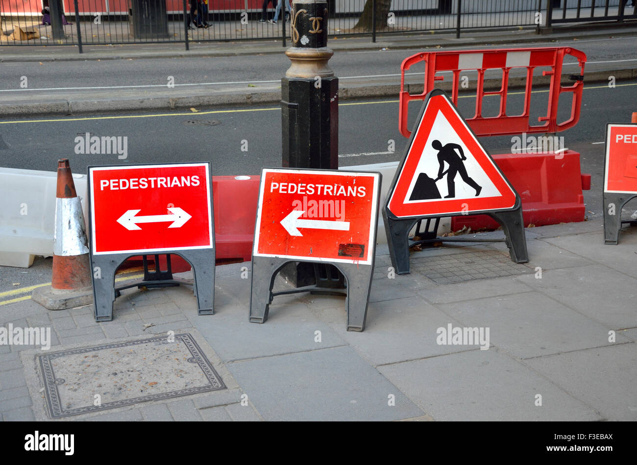 London, England, UK. Confusing / contradictory signs for pedestrians at roadworks Stock Photo