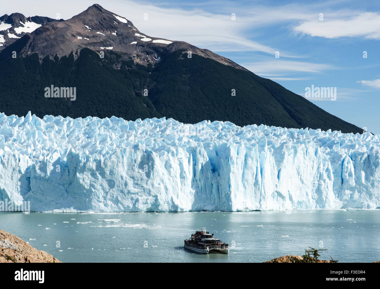 Tourist boat by Perito Moreno glacier, Perito Moreno National Park, Patagonia, Argentina, South America Stock Photo
