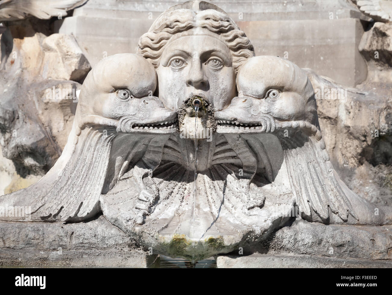 Fragment of decorative fountain with sculptures of woman and dolphins. Italy, Roma. Piazza della Rotonda. Fontana del Pantheon Stock Photo
