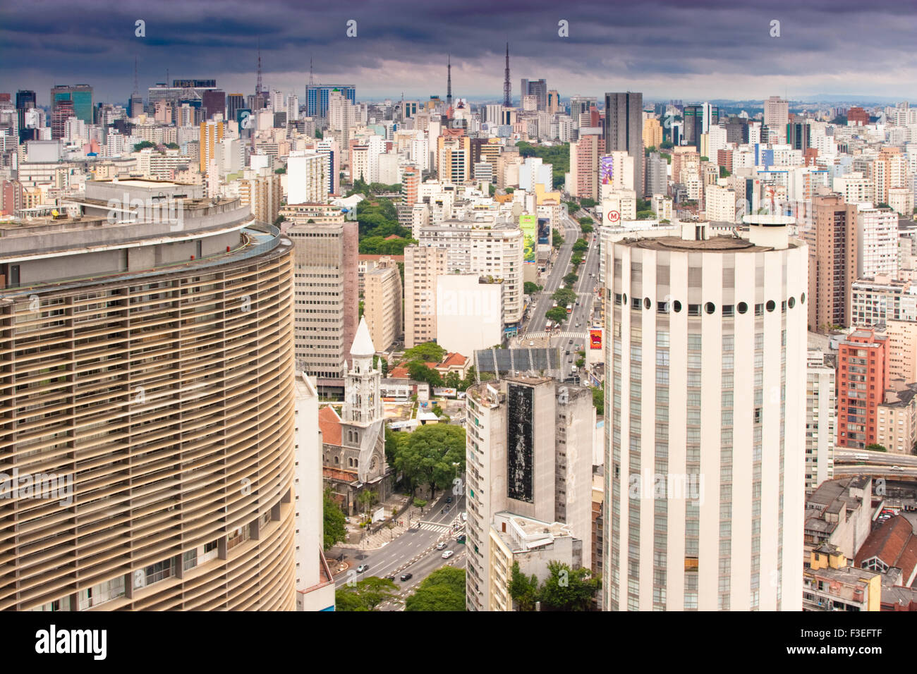 View of Sao Paulo skyline from the Terraco Italia. Niemeyer's Edificio Copan in the curved building in the foreground Stock Photo