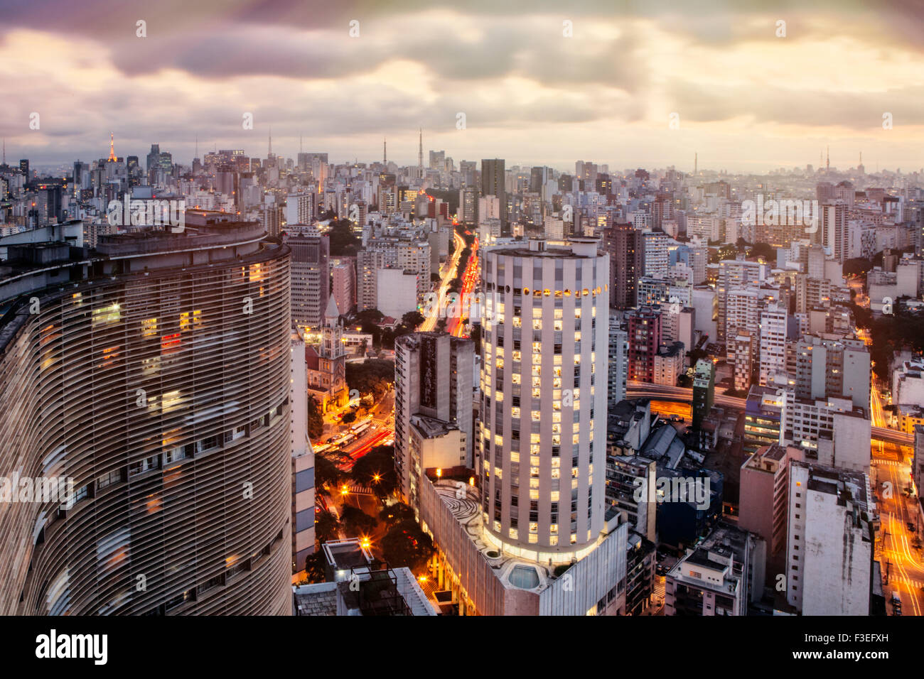 View of Sao Paulo skyline from the Terraco Italia. Niemeyer's Edificio Copan in the curved building in the foreground Stock Photo
