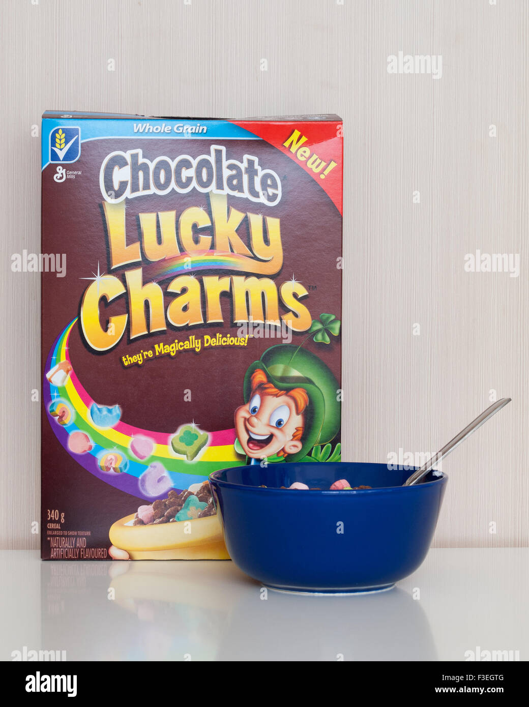 A box and bowl of Chocolate Lucky Charms cereal, manufactured by General Mills. Stock Photo