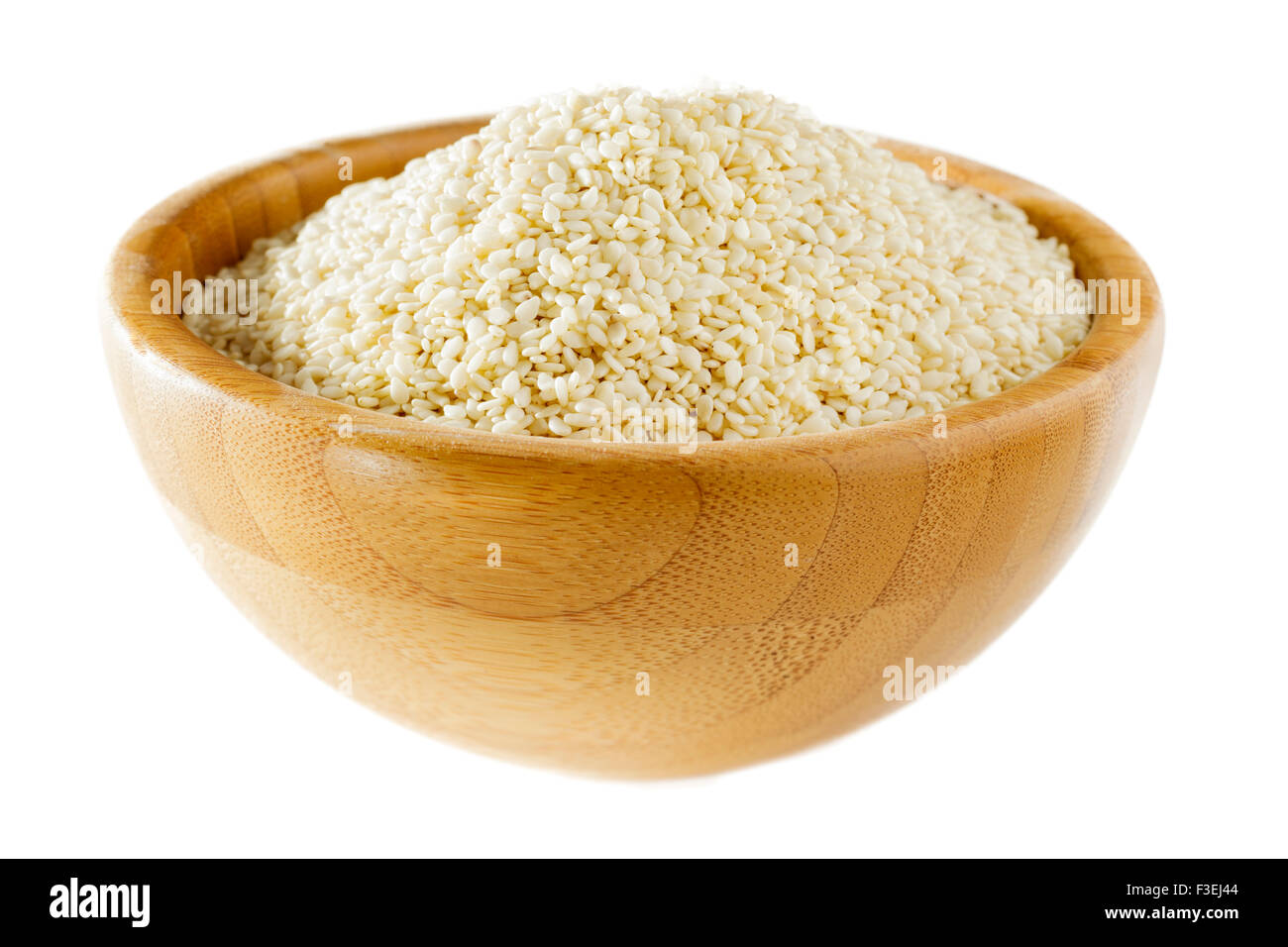 White Sesame seeds in wooden bowl Stock Photo