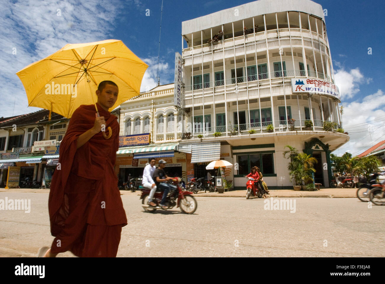 Buddhist monk walking down the streets of Battambang. Battambang is Cambodia's second-largest city and the capital of Battambang Stock Photo