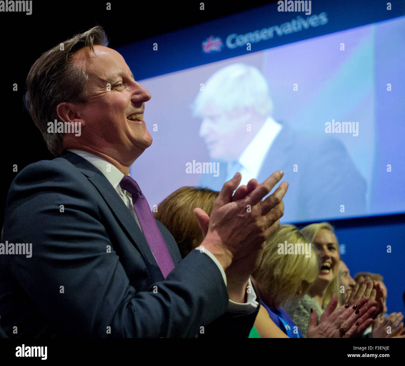 Manchester, UK. 6th October 2015. The Rt Hon David Cameron MP, Prime Minister, laughs and applauds Boris Johnson, Mayor of London, during his speech during Day 3 of the 2015 Conservative Party Conference in Manchester. Credit:  Russell Hart/Alamy Live News. Stock Photo