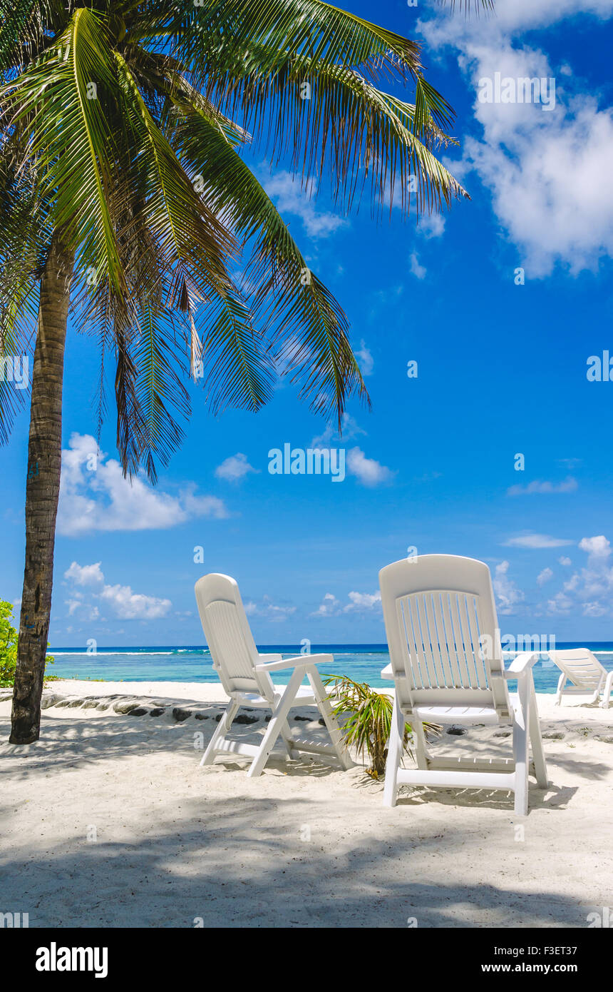 Two beach chairs on perfect tropical white sand beach in Maldives Stock ...