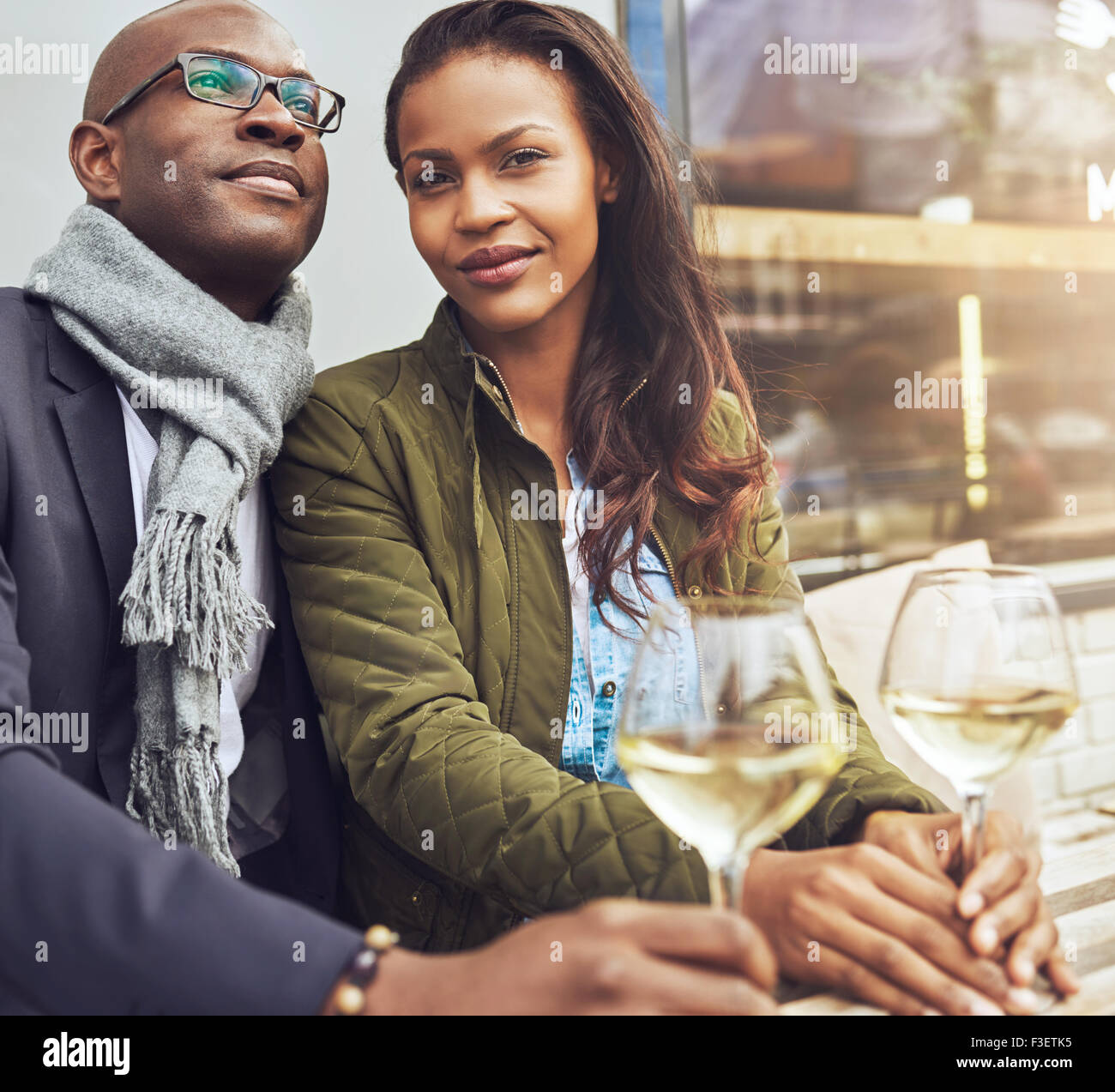 Afro american couple dating, woman looking straight at camera Stock Photo