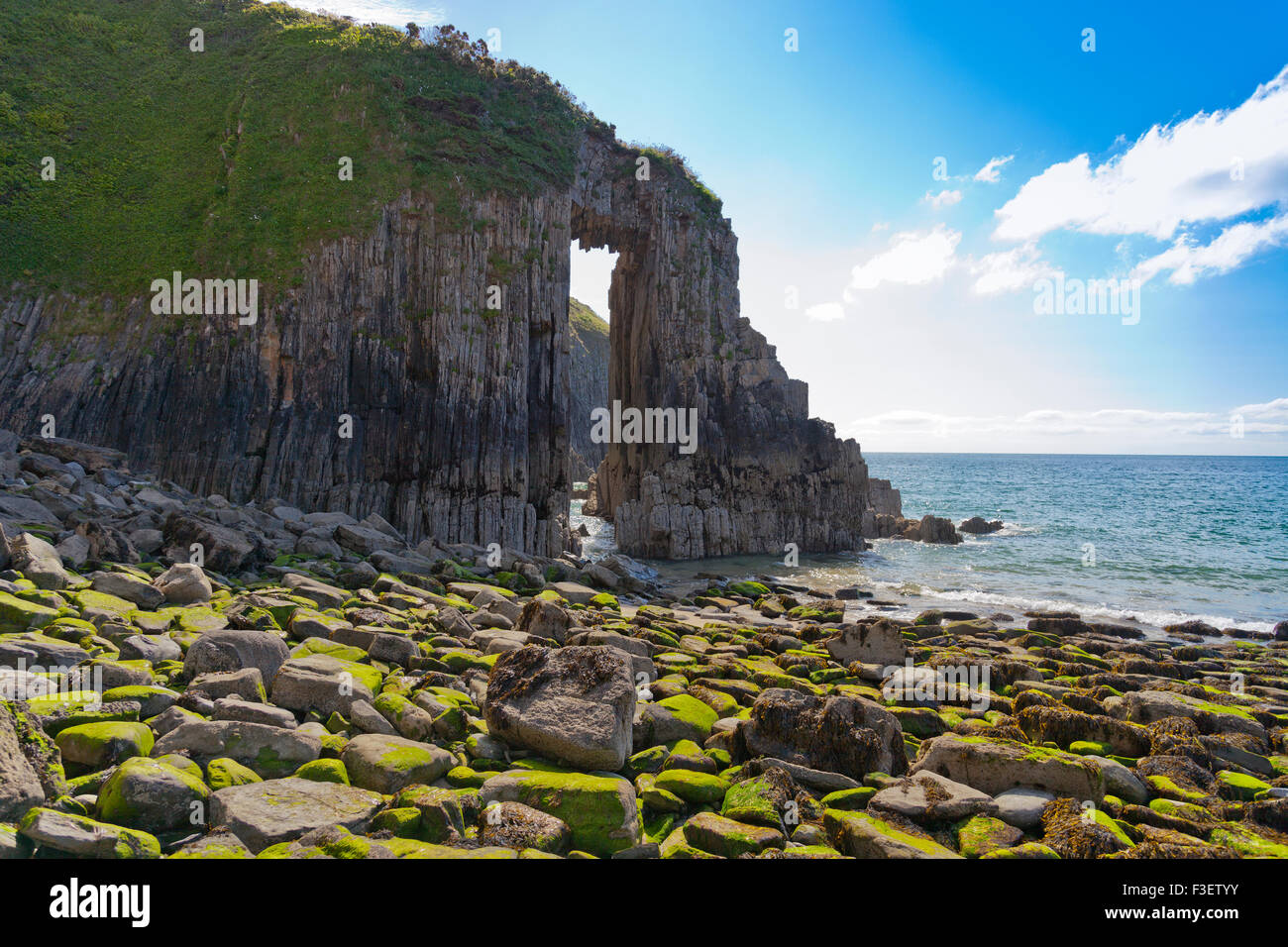 The dramatic natural arch called Church Doors at Skrinkle Haven in the Pembrokeshire Coast National Park, Wales, UK Stock Photo