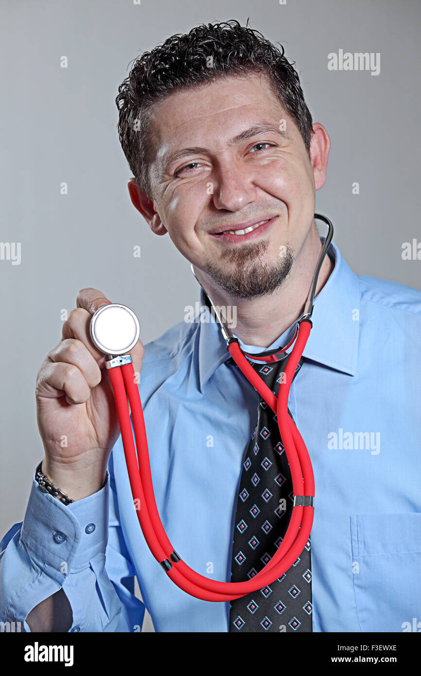 Doctor showing stethoscope hi-res stock photography and images - Alamy