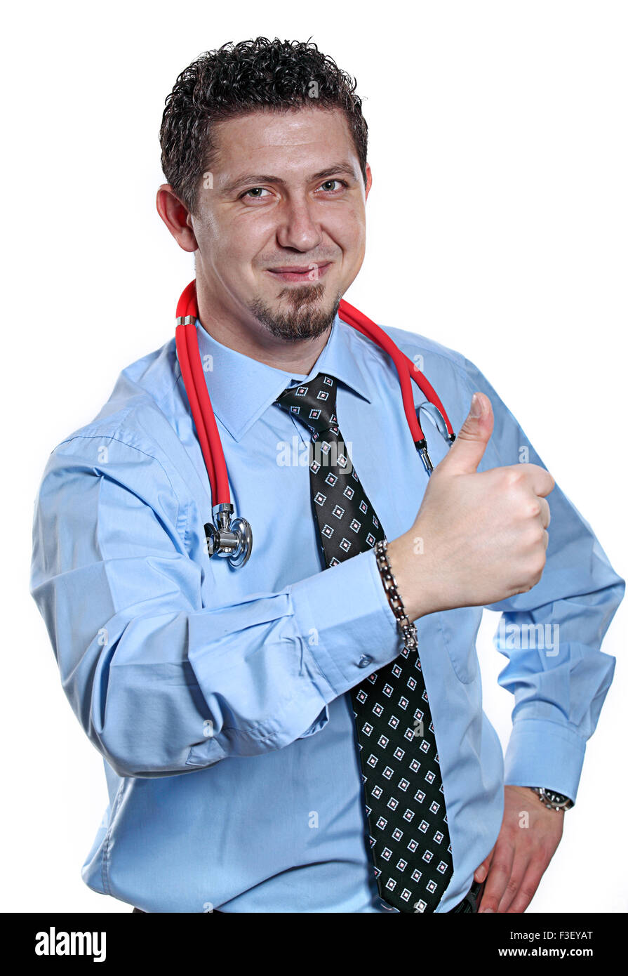 Male doctor is making OK sign with confidence in front of white background. Stock Photo