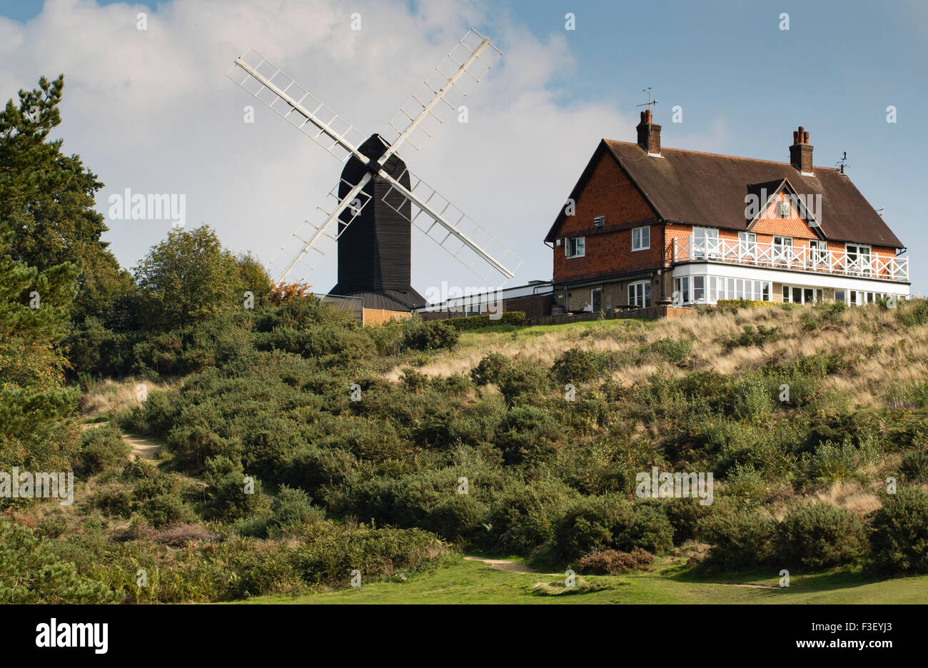 Reigate Heath golf course clubhouse and windmill Stock Photo