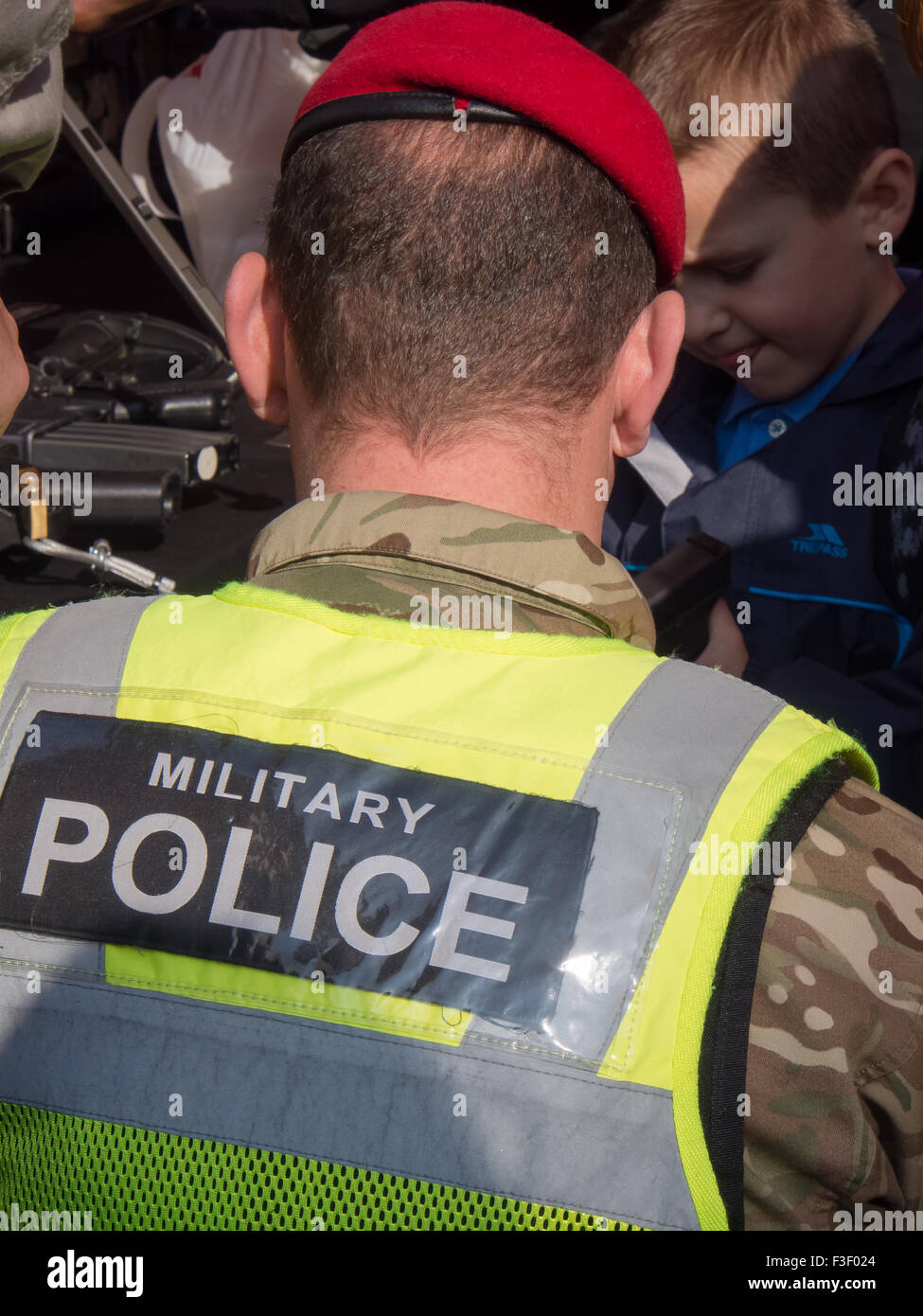 A member of the Military police meeting members of the public Stock Photo