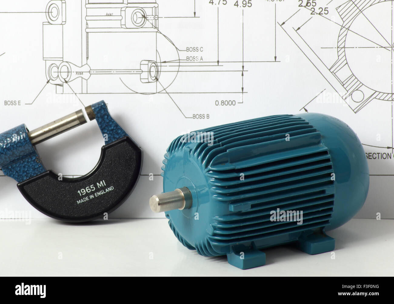 An engineering concept image showing a model of an electric motor and a