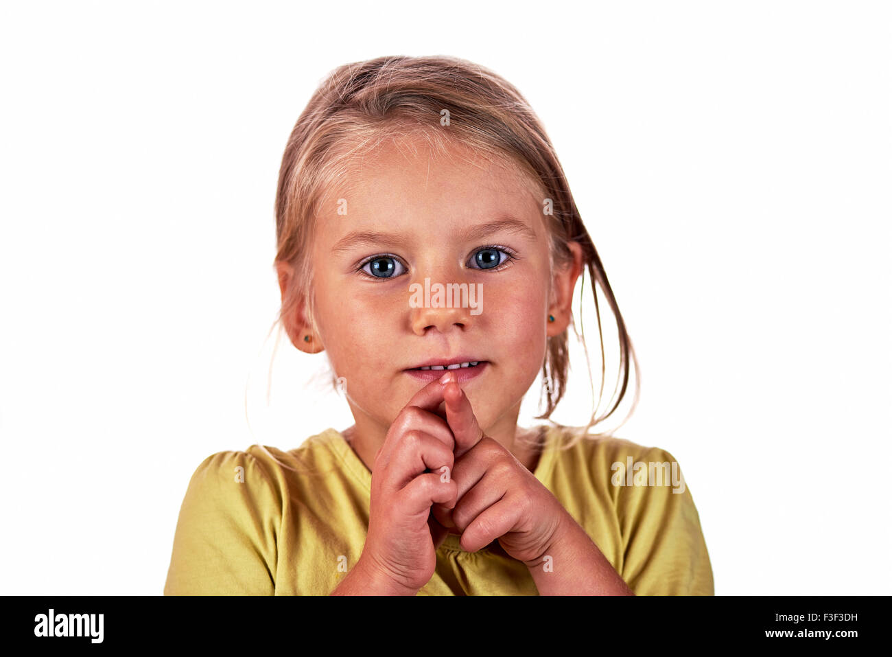 Little girl portrait grimace over white background Stock Photo