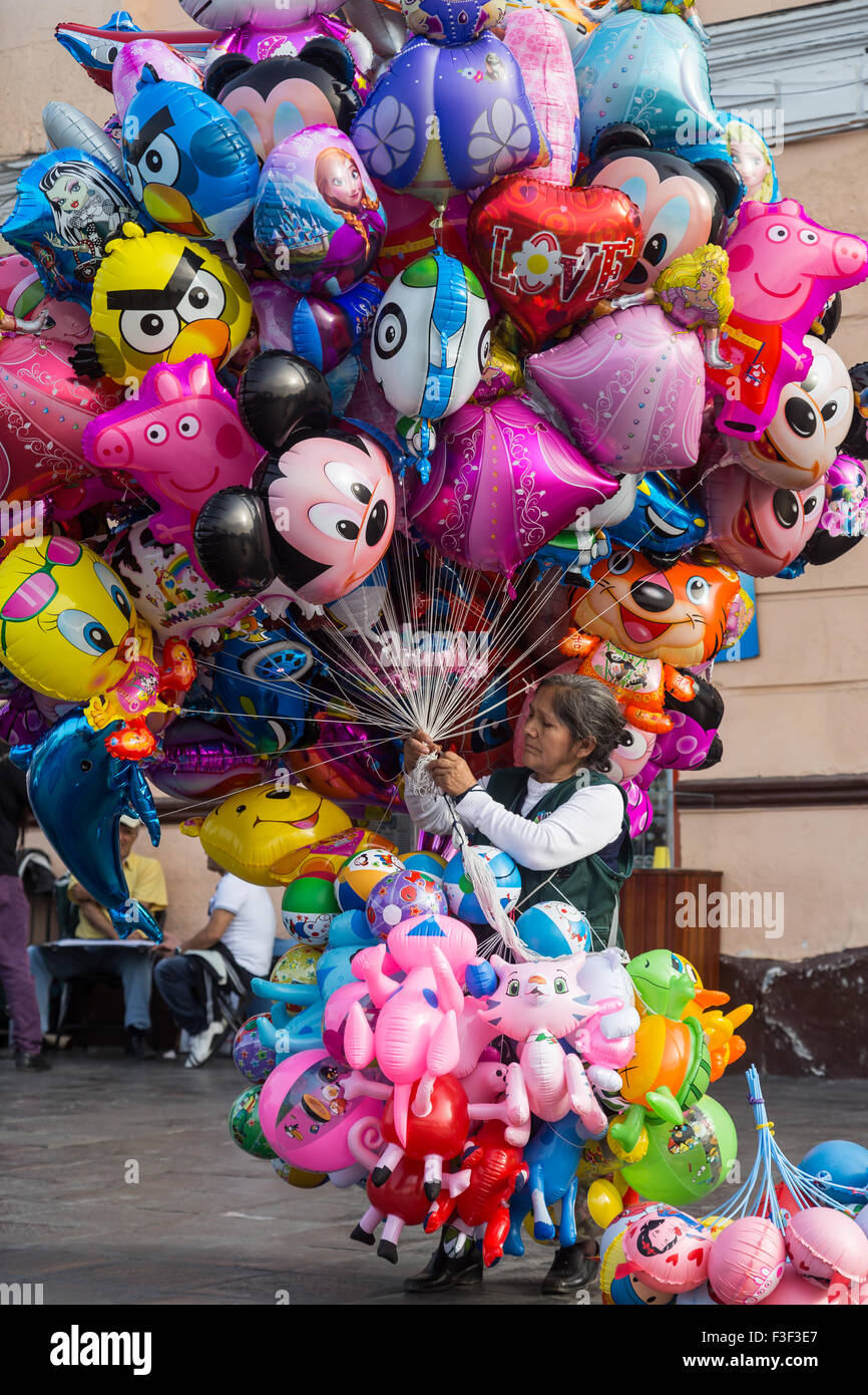 Lima, Peru - September 5, 2015: An old lady selling balloons in the city center on a Saturday afternoon. Stock Photo