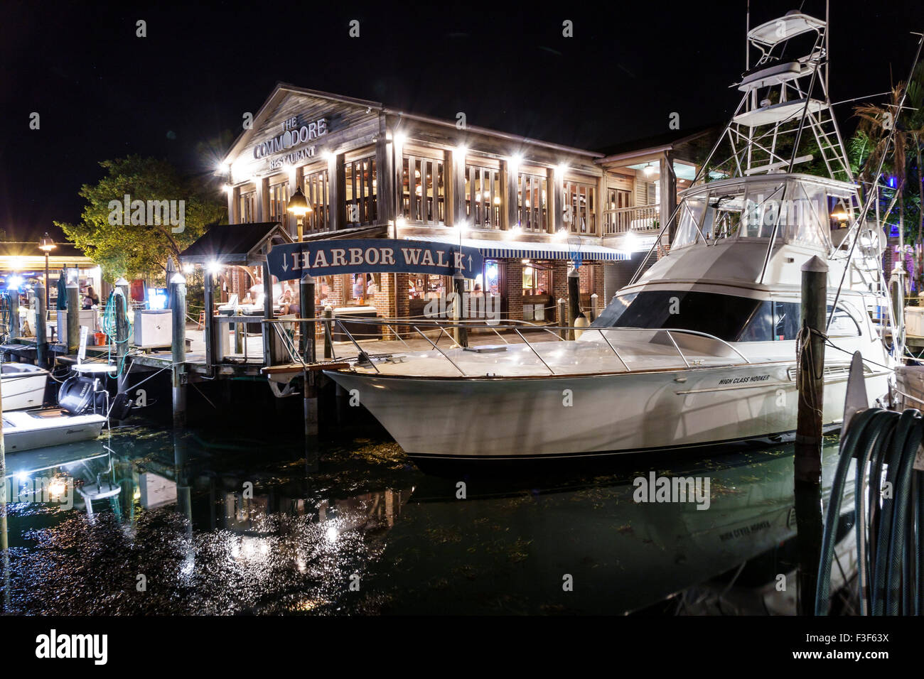 Key West Florida,Keys Old Town,Harbor Walk,harbour,bight,night evening,yacht,boat,The Commodore,restaurant restaurants food dining cafe cafes,FL150508 Stock Photo