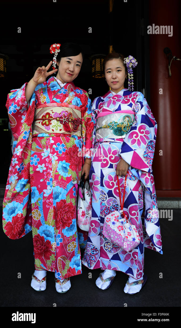 Young Japanese women dressed in colorful traditional Kimono dresses. Stock Photo
