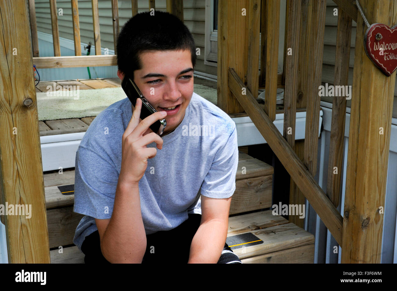 12-13 year old boy on cell phone. Stock Photo