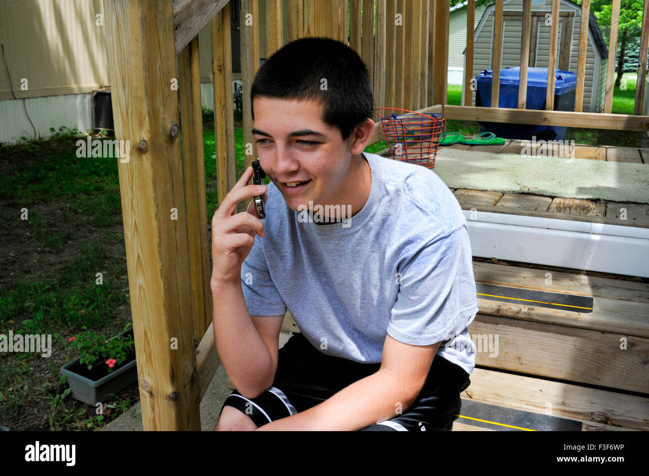 12-13 year old boy on cell phone. Stock Photo