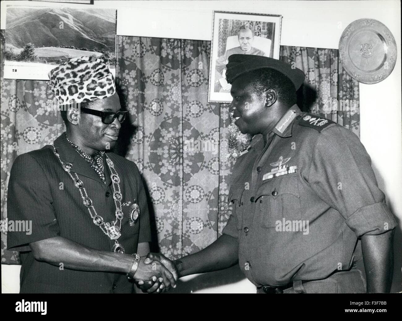 1974 - After presenting him with the order of the Source of the Nile President Amin Congratulates Zaire President Mobutu Sese Sako. From the wall, an official portrait President Nyerere looks down. Credit: Camerapix. © Keystone Pictures USA/ZUMAPRESS.com/Alamy Live News Stock Photo