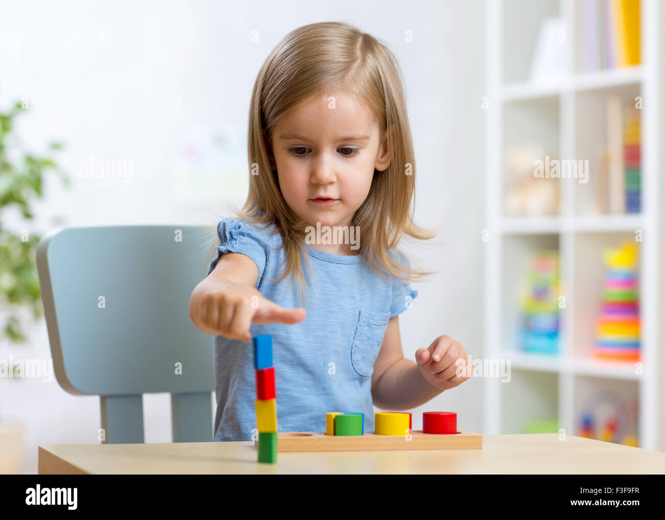 little child kid playing with building blocks Stock Photo Alamy