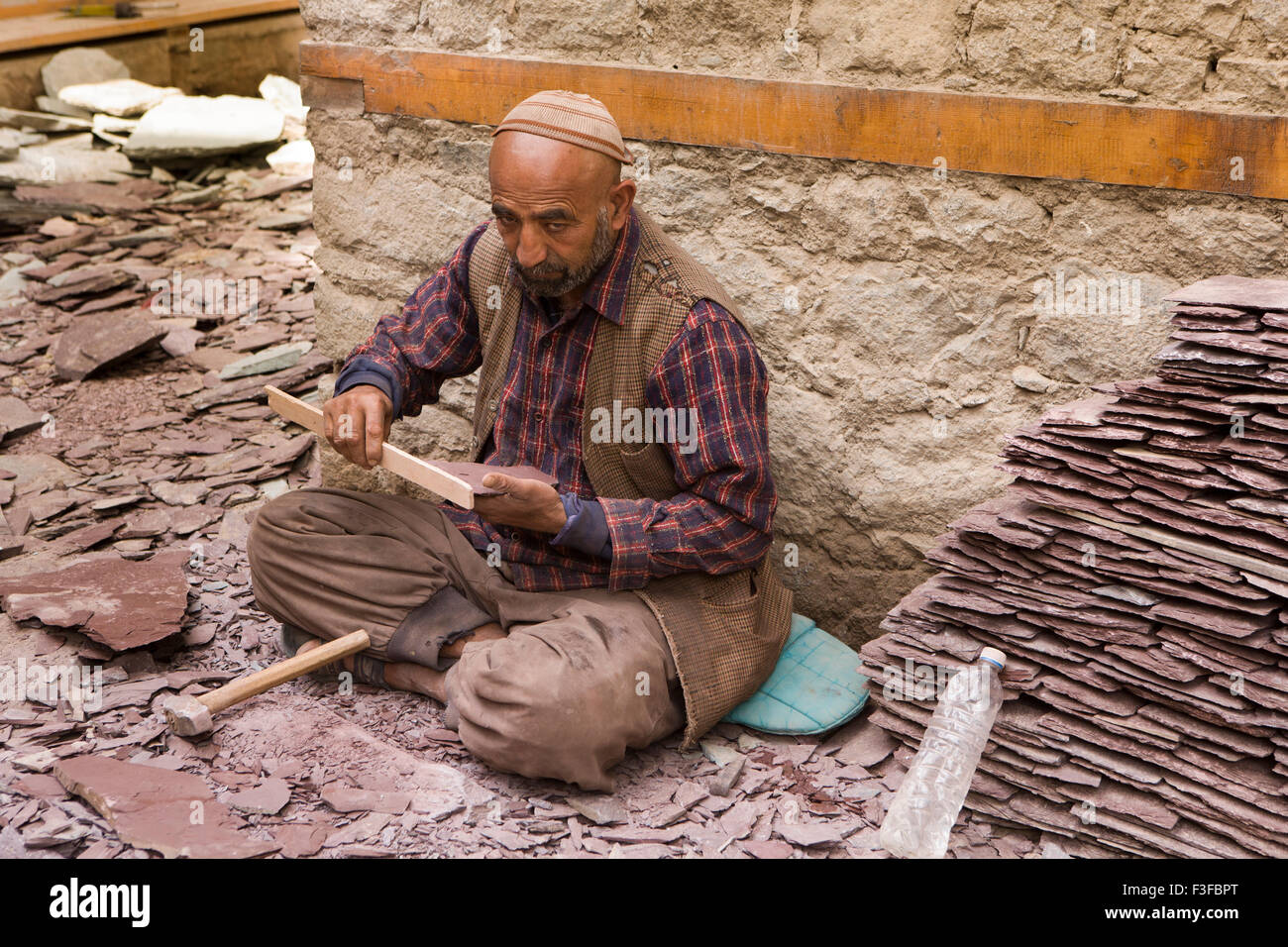 N3623India, Jammu & Kashmir, Ladakh, Leh, Old Town, Central Asian Museum, man preparing roofing slates Stock Photo