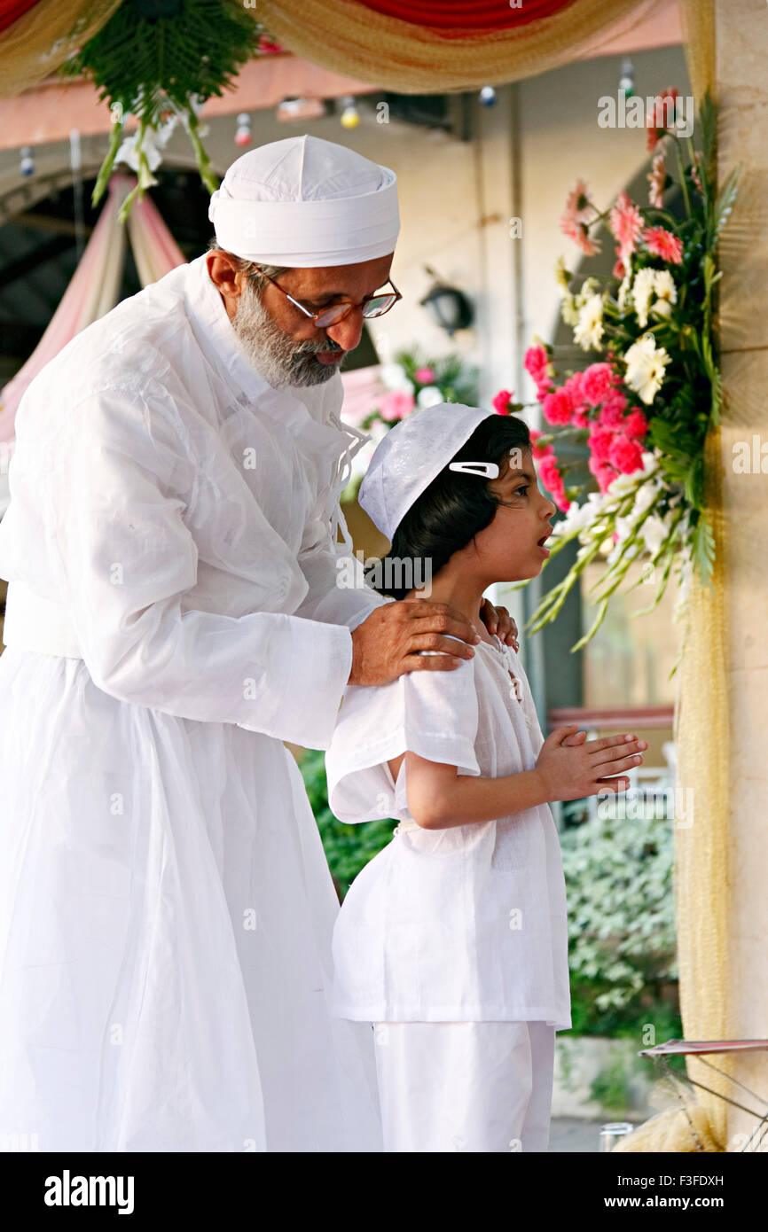 Blessing from priest ; ritual ; Parsi Navjot a thread ceremony ; India MR#735 Stock Photo