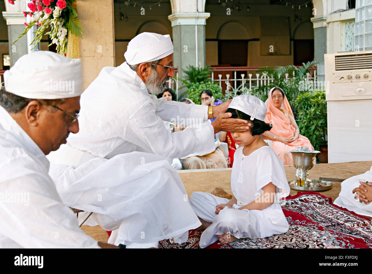 Blessing from priest ; ritual ; Parsi Navjot a thread ceremony ; India MR#735 Stock Photo