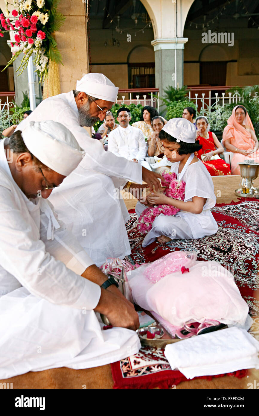 Blessing from priest ; ritual ; Parsi Navjot a thread ceremony ; India MR#735 Stock Photo