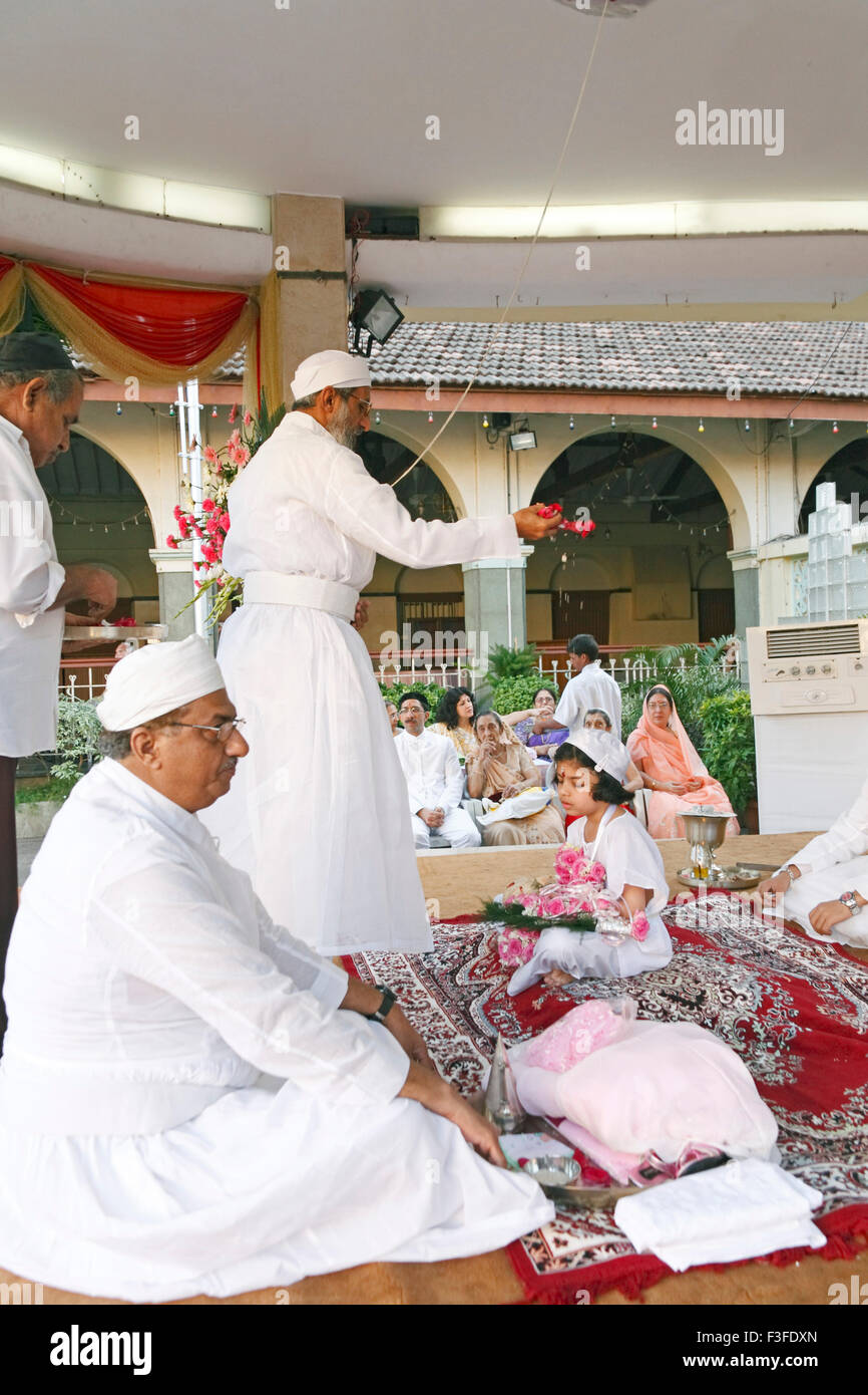 Blessing from priest ; ritual ; Parsi Navjot a thread ceremony ; India MR#735 Stock Photo