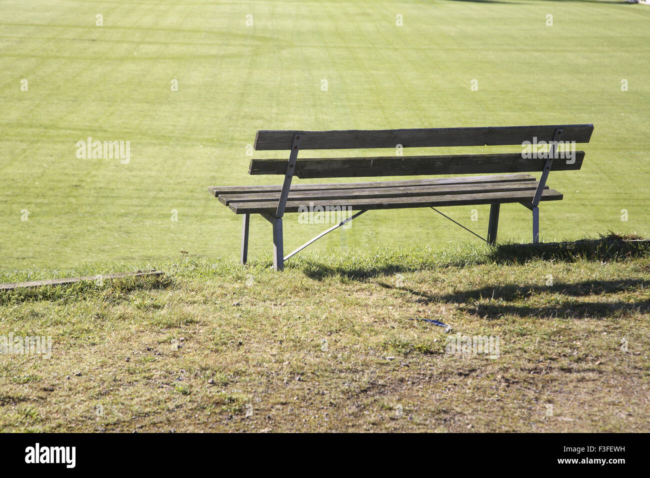 Wooden bench for sitting near football ground ; Sweden Stock Photo