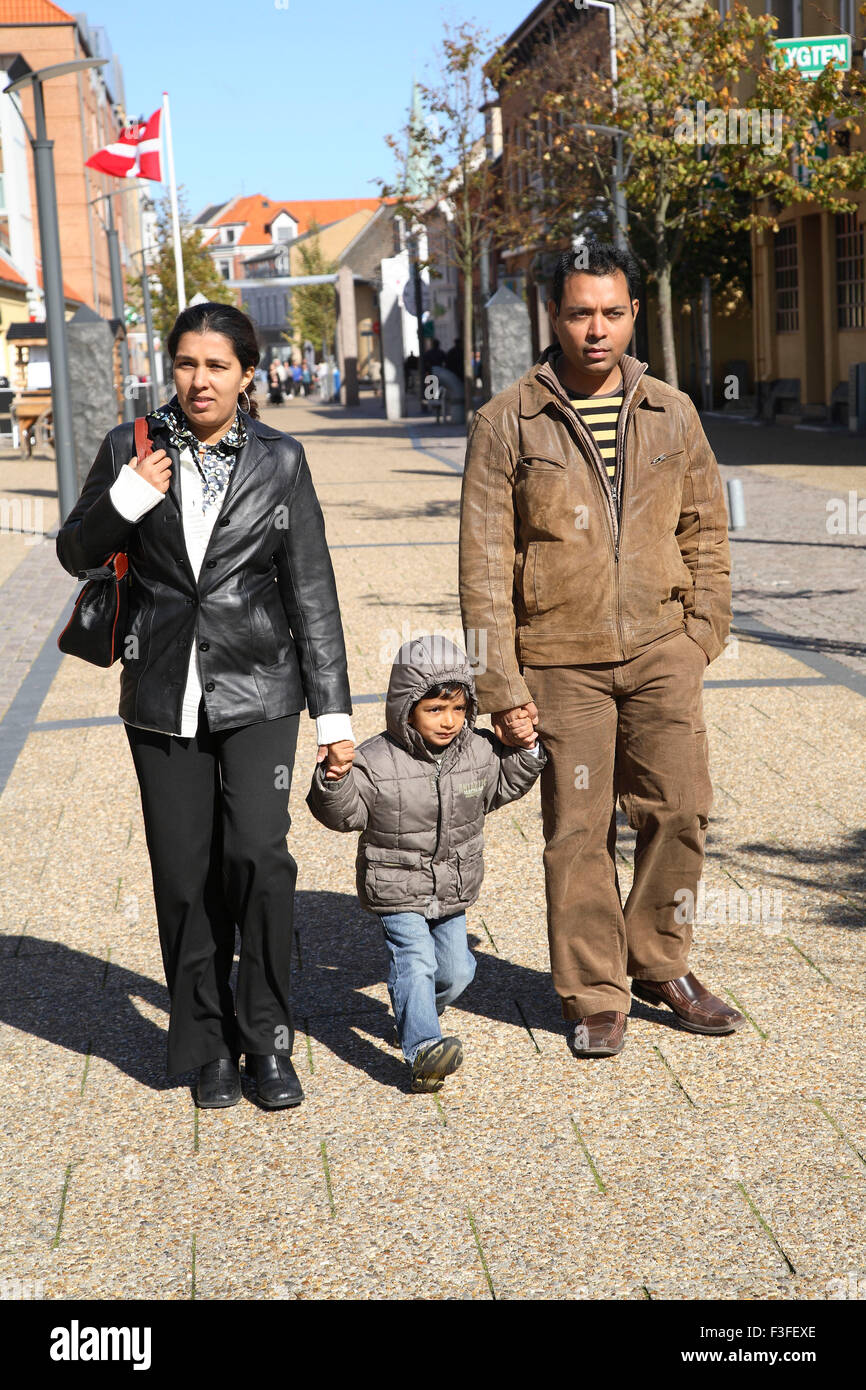 Parent with four years old son walking on streets of Frederikshavn ; Denmark ; Scandinavia MR#468 Stock Photo