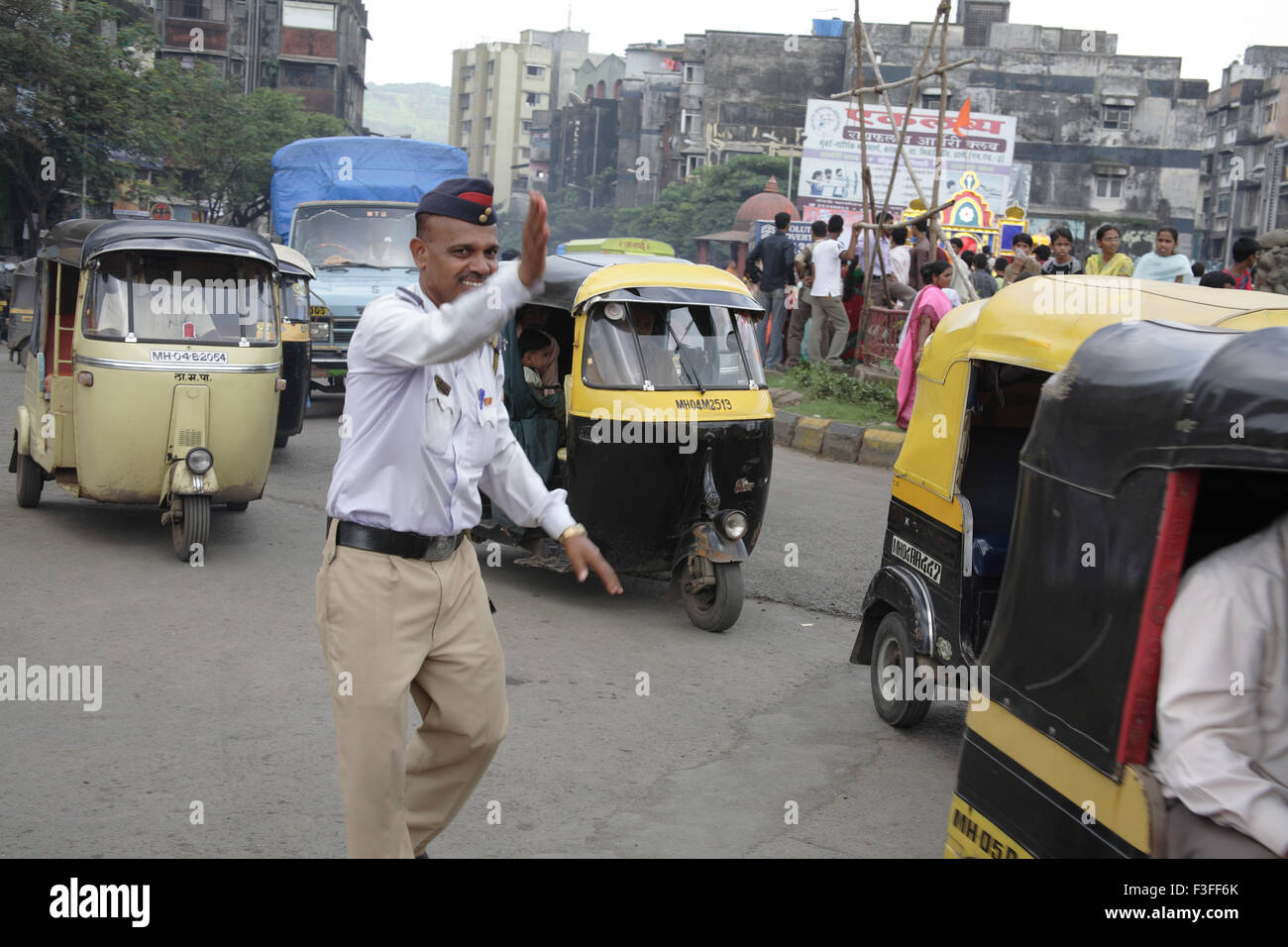 Trafic police controlling trafic during the religious procession at Kalwa Junction ; Thane ; Maharashtra ; India;NO MR Stock Photo