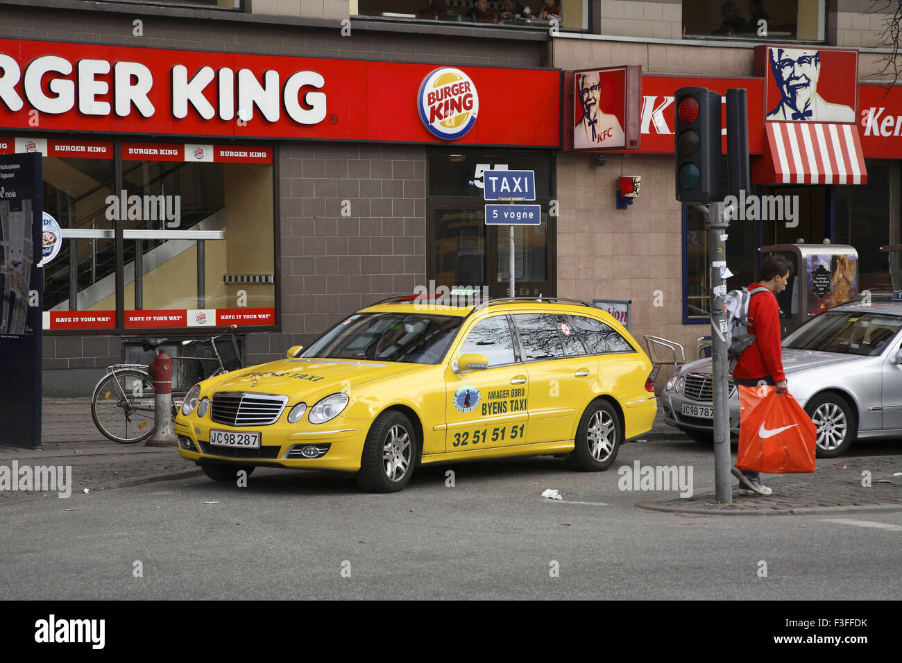 Yellow taxi cab stand on road ; Copenhagen ; Denmark ; Scandinavian Stock Photo