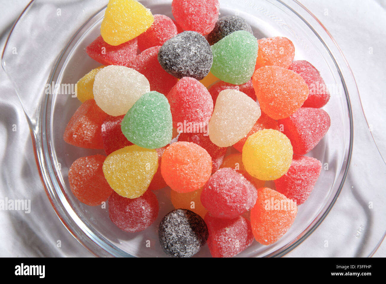 Assortment of American Hard Gums arrangement in transparent tray ; sugar coated colourful soft jelly sweets Stock Photo