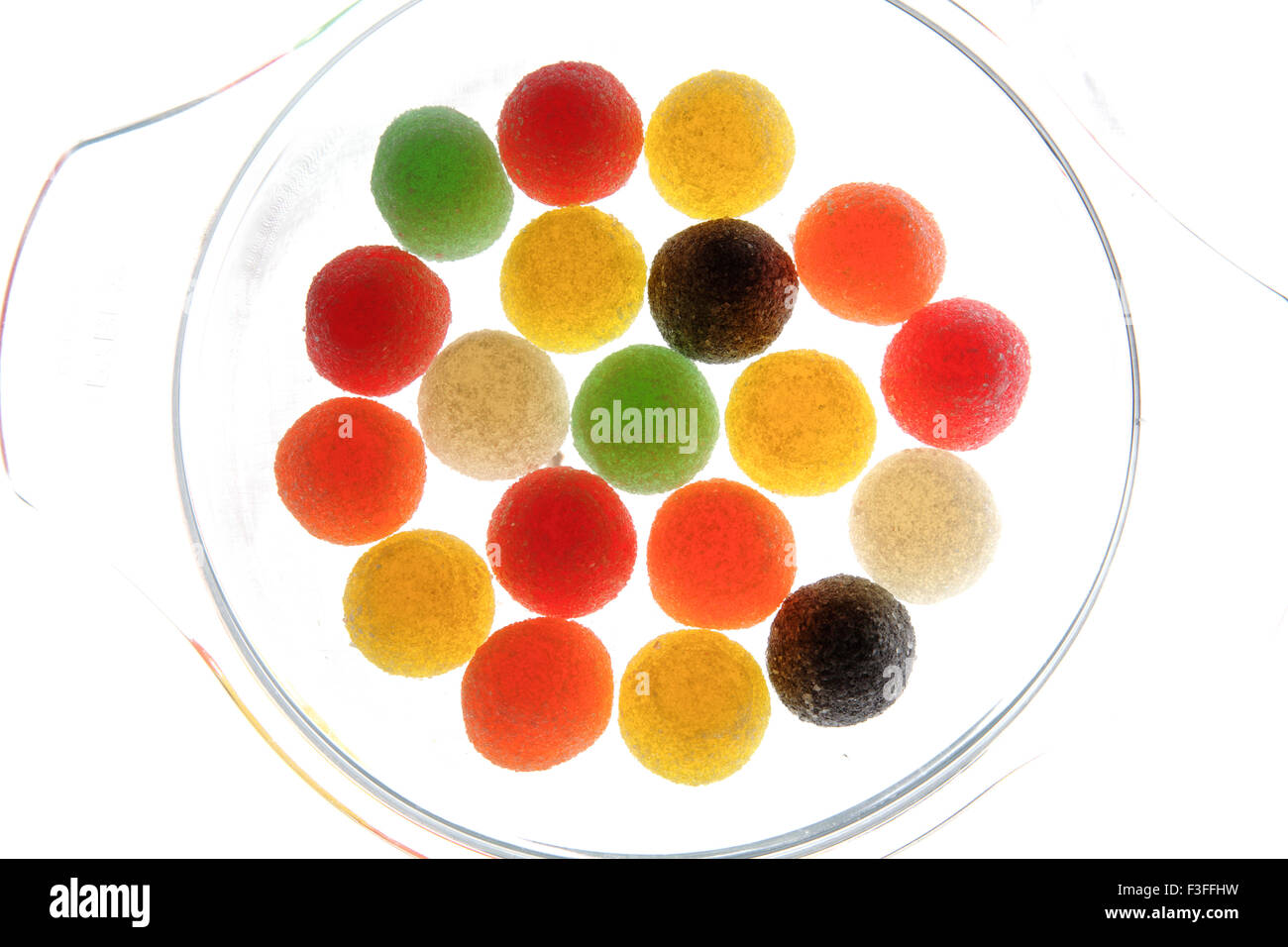 Assortment of American Hard Gums arrangement in transparent tray ; sugar coated colourful soft jelly sweets Stock Photo