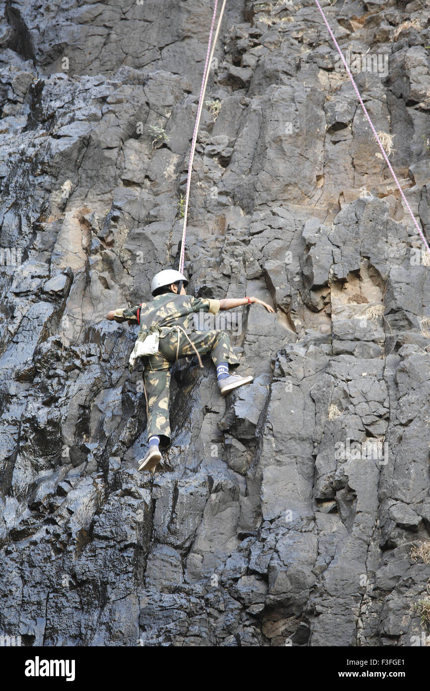 Commando obstacles training rock climbing at Amboli Ghat ; Amboli hill station ; Military school ; Amboli Sindhudurga Stock Photo