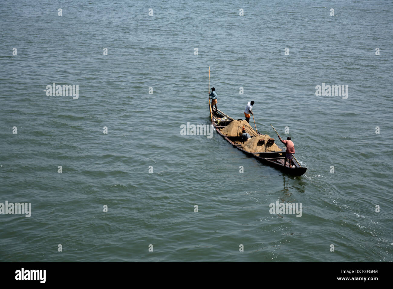 Transport sand by small boat near Chettuvai bridge ; Kerala ; India Stock Photo