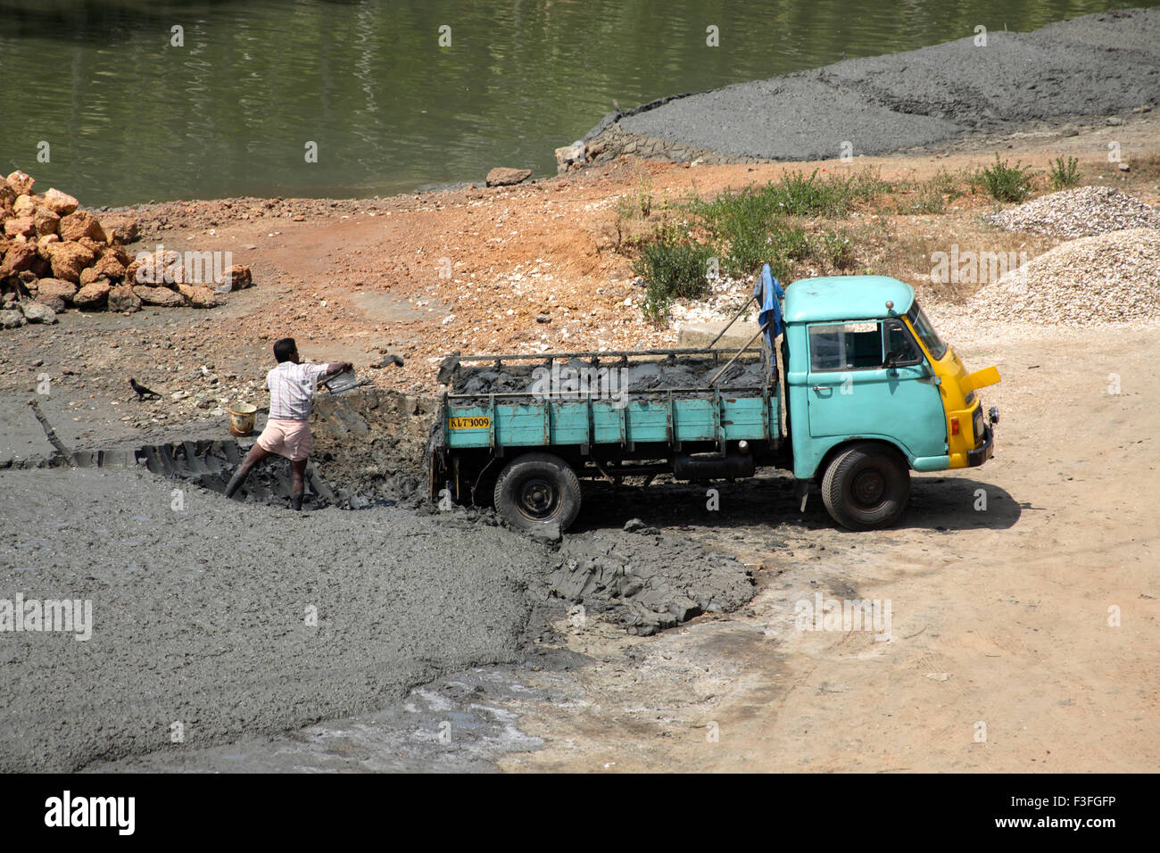Mud lifted into small truck near Chettuvai Bridge ; Kerala ; India Stock Photo